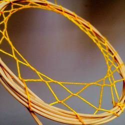 Close-up of basketball hoop against sky