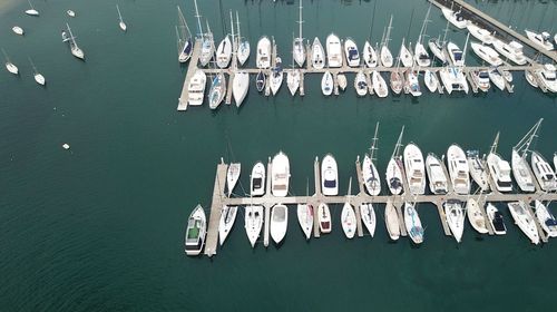 High angle view of sailboats moored in lake