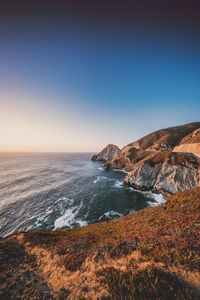 Scenic view of sea against clear blue sky