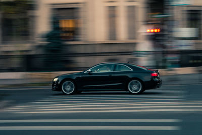 Blurred motion of car on road