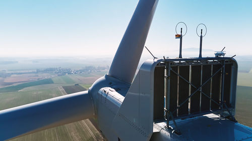 Aerial view of part of windmill turbine in countryside, green energy