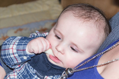 Close-up of woman carrying baby