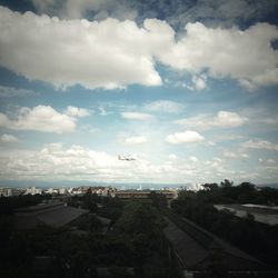 Aerial view of town against sky