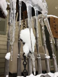 Close-up of icicles hanging on snow