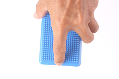 Close-up of human hand against white background