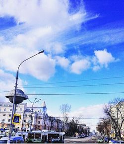 Low angle view of power lines against sky