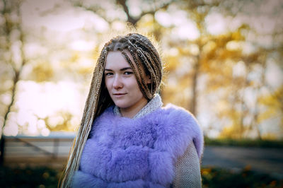 Portrait of smiling woman wearing warm clothing