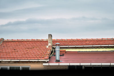 High section of building against cloudy sky