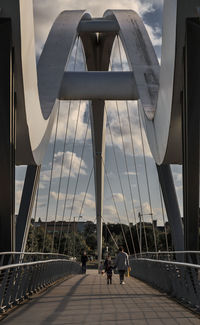 Man walking on footbridge