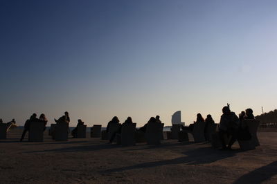 Silhouette of woman against clear sky