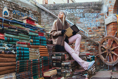 Young woman reading book