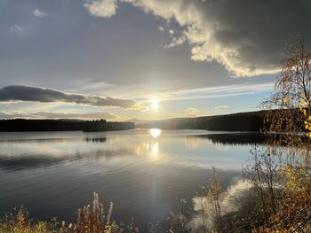 Scenic view of lake against sky during sunset