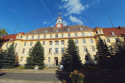 Facade of front of building against blue sky