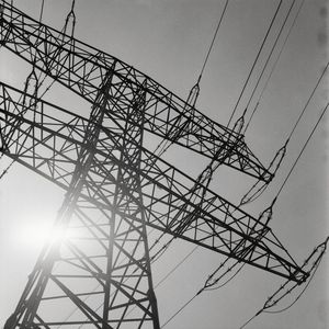 Low angle view of electricity pylon against sky