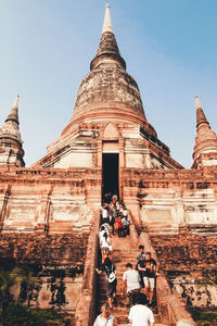 Group of people in temple against building