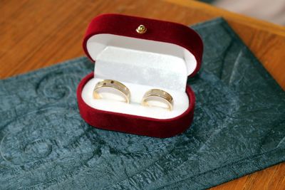 High angle view of wedding rings on table