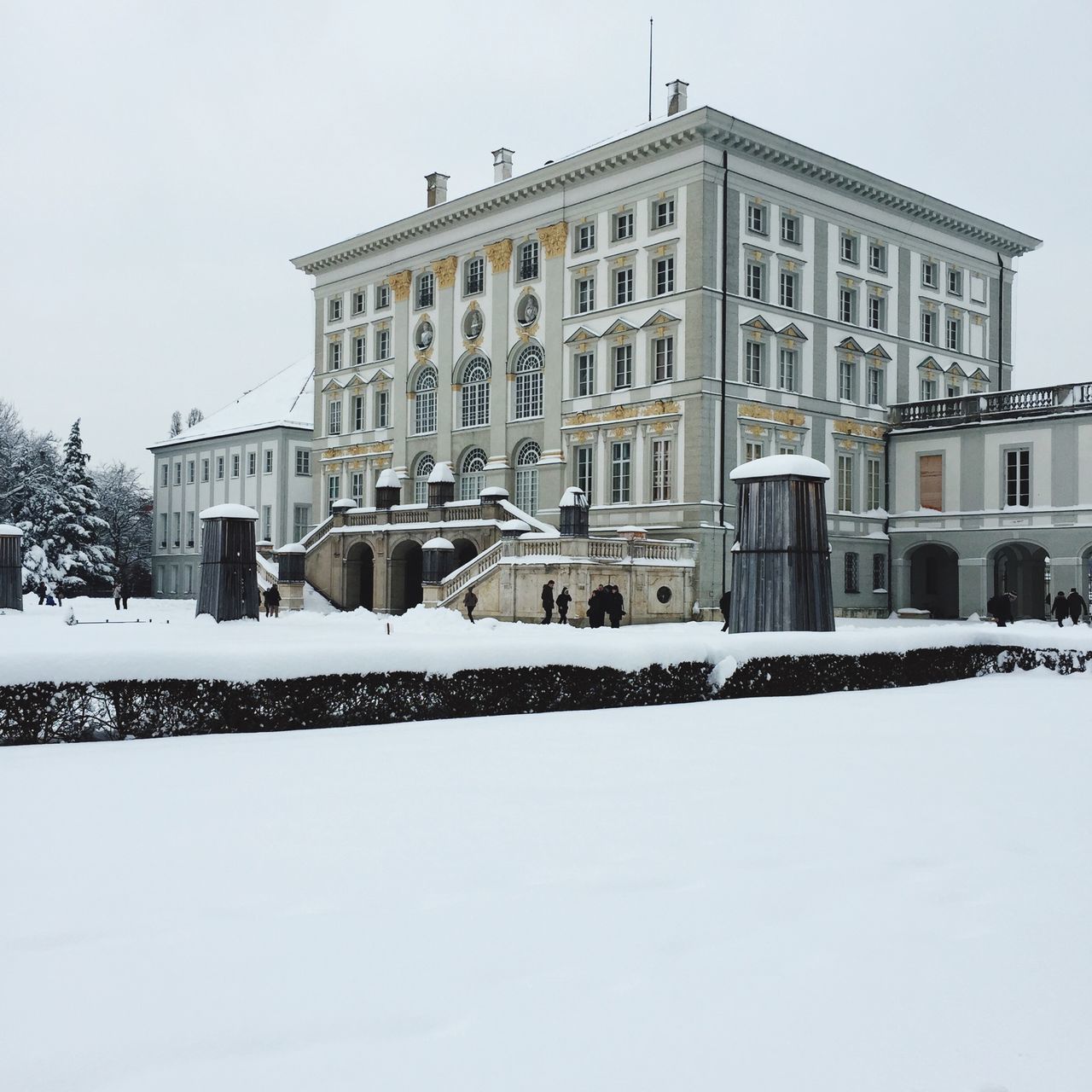 building exterior, architecture, built structure, snow, winter, cold temperature, clear sky, season, building, white color, weather, residential building, low angle view, covering, residential structure, day, city, sky, outdoors, window