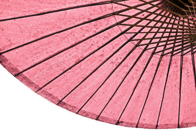 Low angle view of spiral staircase against white background
