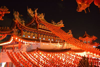 Low angle view of illuminated building at night