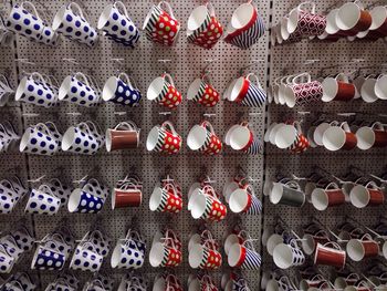 Close-up of cups in row