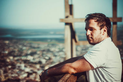 Man standing by sea against sky