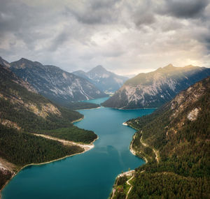 Scenic view of lake and mountains against sky