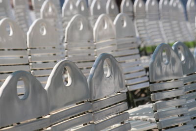 Close-up of chairs in row