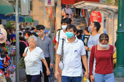 Group of people walking in city