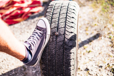 Low section of man wearing shoes