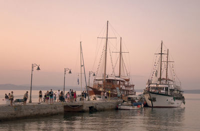 Sailboats in sea against clear sky