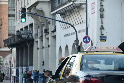 Close-up of cars on street