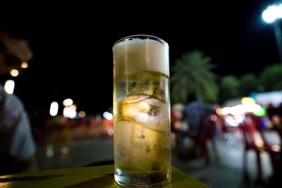 Close-up of beer glass on table