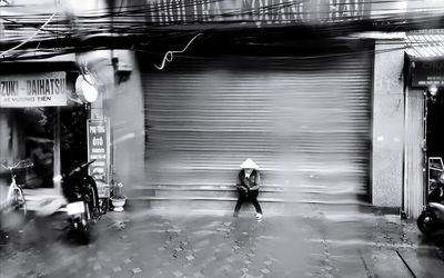 People walking on street in rain