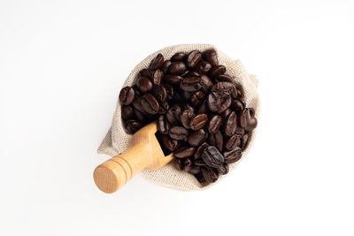 Close-up of coffee beans against white background