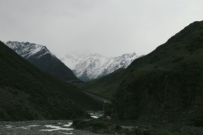 Scenic view of snow covered mountains