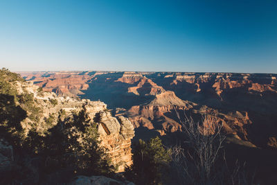 Scenic view of grand canyon national park against clear blue sky during sunset