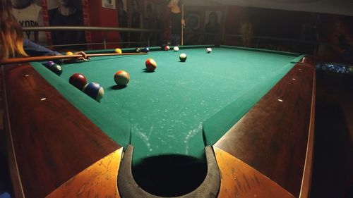 Man playing with ball in pool