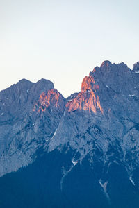 Scenic view of snowcapped mountains against clear sky