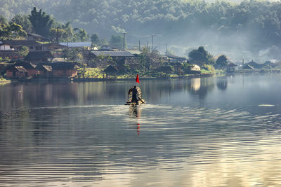 Full length of man on lake against sky