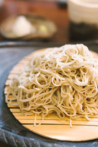 Close-up of noodles in plate on table