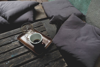 High angle view of coffee in cup on table