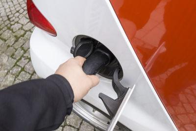 Low section of man holding car