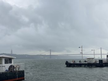 Bridge over sea against sky