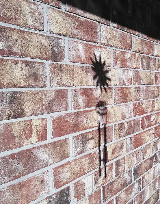 LOW ANGLE VIEW OF BRICK WALL ON STONE