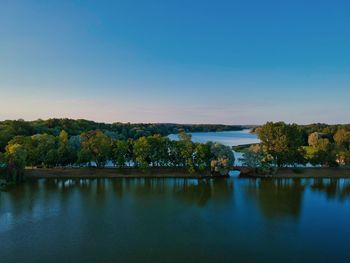 Scenic view of lake against blue sky