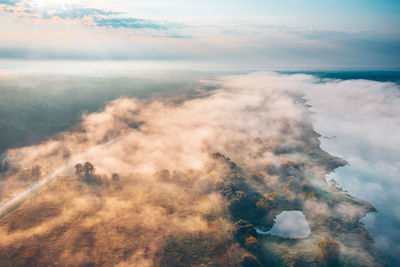 Aerial view of sea against sky during sunset