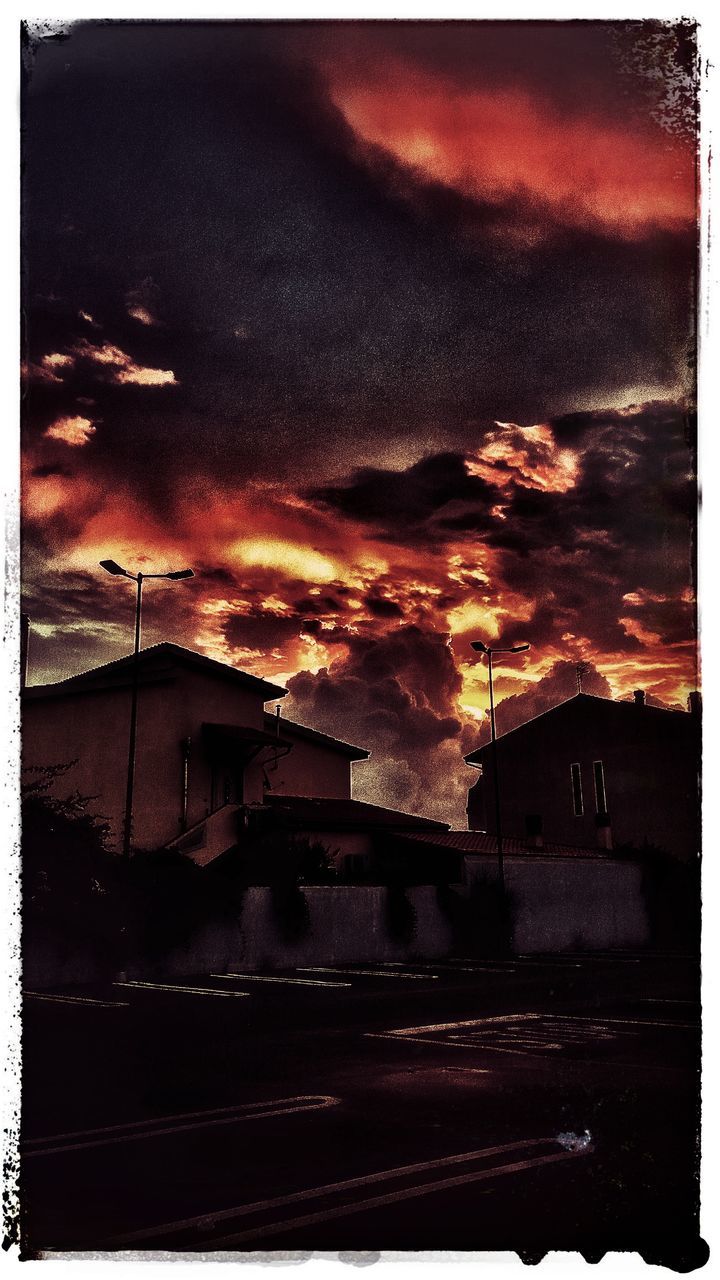 VIEW OF STREET AGAINST CLOUDY SKY