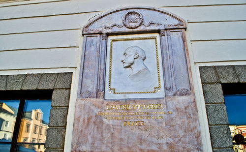 Low angle view of statue against building