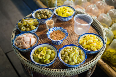 High angle view of fruits in basket on table