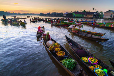 High angle view of boats in river at sunset